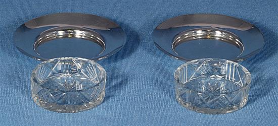 A cased Victorian silver scallop shaped butter dish and knife and a pair of butter dishes, 74 grams.